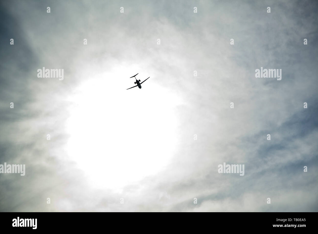 The airplane flies to the sun. bird`s eye view Stock Photo